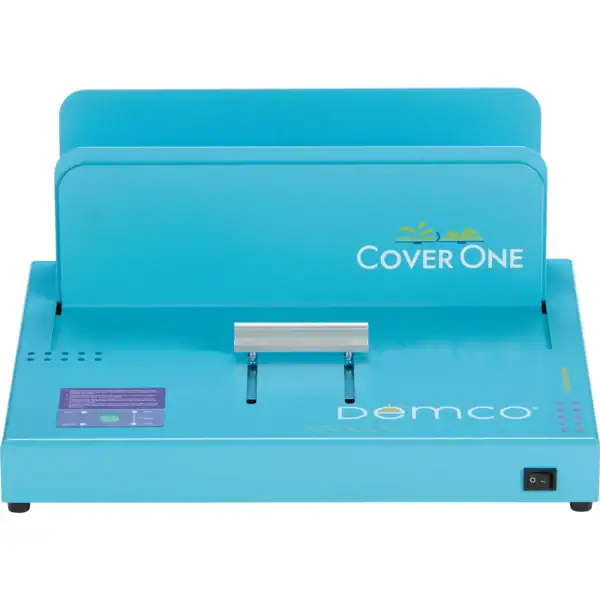 A blue Cover One book binding machine by Demco, featuring a metal clamp in the middle, control buttons on the left, and an on/off switch on the front right corner.